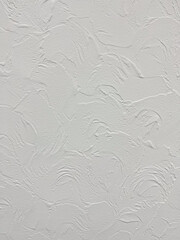 Fototapeta premium Abstract background of a white textured wall with decorative plaster strokes