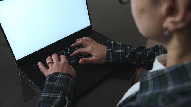 Remote Work Setup: Hands on Laptop Keyboard with Blank Screen
