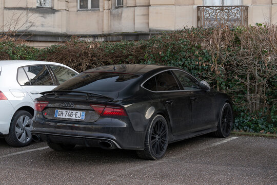 Nancy, France - January 17th 2026 : View on a black Audi RS7 Sportback parked on a parking lot with a hedge in the background.