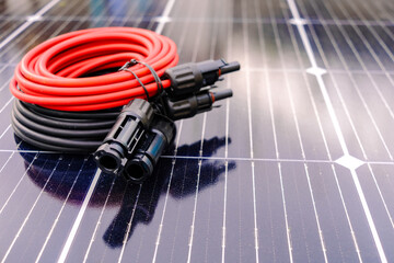 Solar cables connecting to power a home from solar panel energy system © Road Red Runner