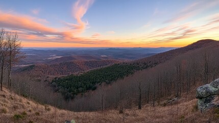 Fototapeta premium Panoramic mountain views at a vibrant sunset with stunning light contrasts and expansive horizons