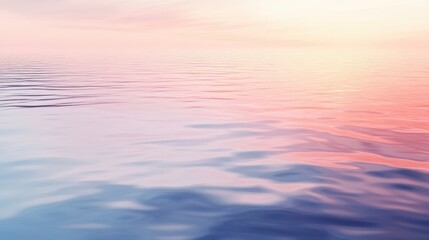 Fototapeta premium Tranquil water surface reflecting soft pastel sky at dawn or sunset evoking serene natural beauty