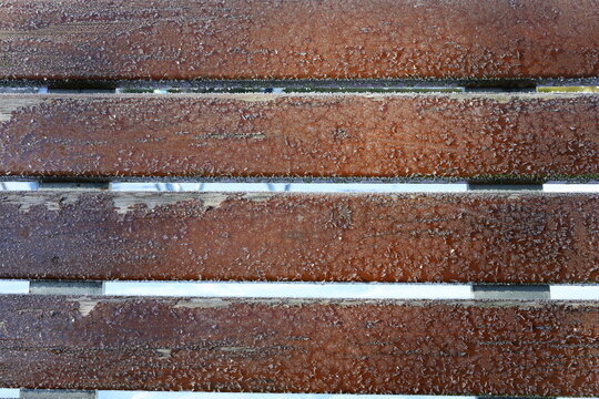 Wooden planks with hoarfrost or plenty of snowflakes.