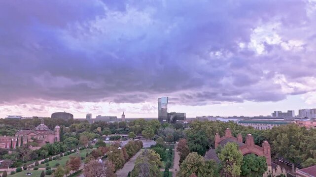 Aerial view of barcelona's parc de la ciutadella and skyline at sunset