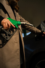 Fuel pump nozzle inserted into car tank for refueling © Rabizo Anatolii