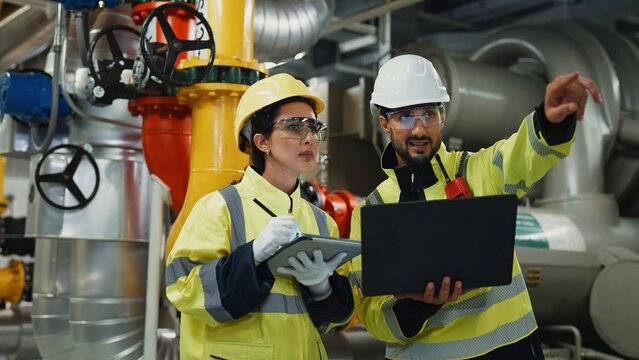 HVAC engineer conducts preventive maintenance and system tuning to optimize energy use and reliability in factory and building systems. 