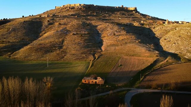 Aerial drone view of medieval castle ruins of San Esteban de Gormaz Soria historic fortress landscape Spain. High quality 4k footage