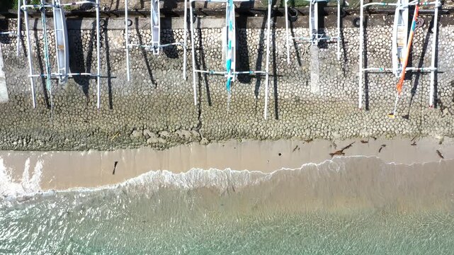 Nusa Penida, Indonesia &ndash; Drone Ascending Over Traditional Jukung Boats on Crystal Beach