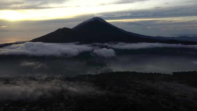 Bali, Indonesia &ndash; Flying Toward Mount Abang at Sunrise Above Cloud Inversion