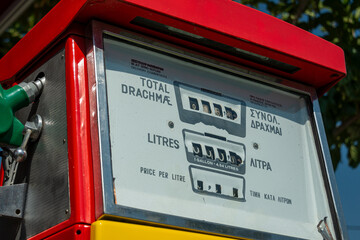 old gas pump that charges in Greek drachmas
