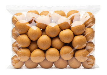 A large pile of freshly baked golden brown bread rolls stacked together tightly