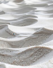 Obraz premium Abstract Close Up Of Rippled Sand Dunes With Small Colorful Object In Sunlight