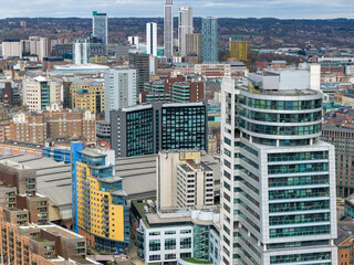 Elevated drone panorama of Leeds city centre with Whitehall Waterfront apartments and surrounding skyline near the River Aire and station district in the winter time © Duncan