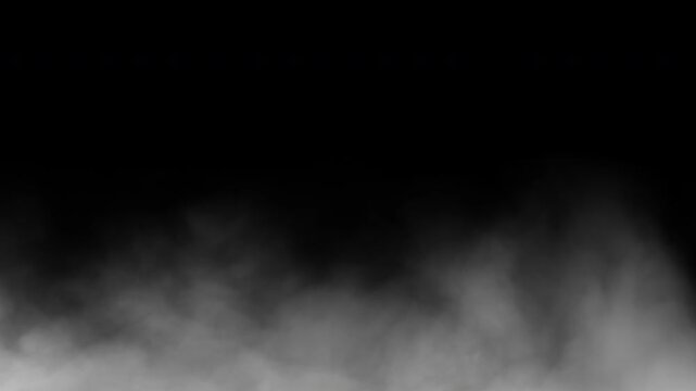 White fog rolling low to the ground against a black background. Seamless looped.