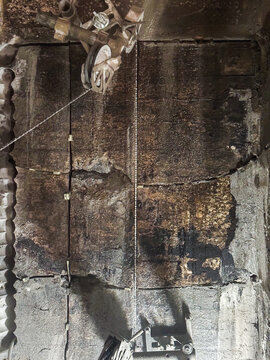 Diamond wire sawing used for cutting thick concrete structure in industrial construction work.