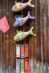 Colorful Paper Fish Decoration on Wooden Wall