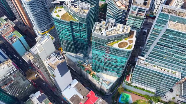 Drone Aerial shots of Hong Kong Kowloon Bay revitalized commercial district, showcasing transformed industrial buildings into modern office towers near Kai Tak and Kwun Tong