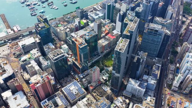 Drone Aerial shots of Hong Kong Kowloon Bay revitalized commercial district, showcasing transformed industrial buildings into modern office towers near Kai Tak and Kwun Tong