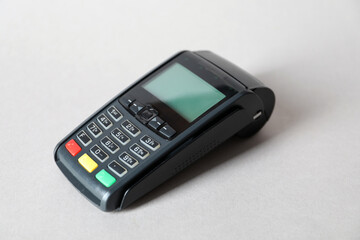 Obraz premium One payment terminal on white table, closeup. Space for text