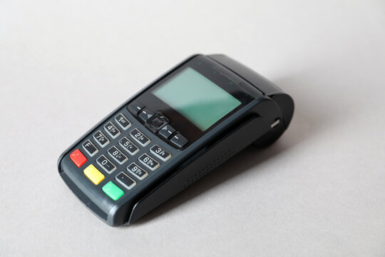 One payment terminal on white table, closeup. Space for text