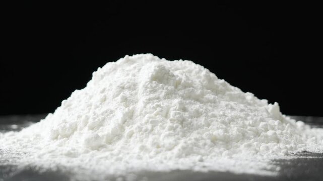 white flour or starch on black background