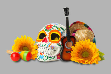 Obraz premium Colorful skull, guitar, maracas, and flowers on gray background