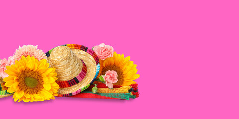 Obraz premium Cinco de Mayo, Colorful flowers and sombrero are set for festive event