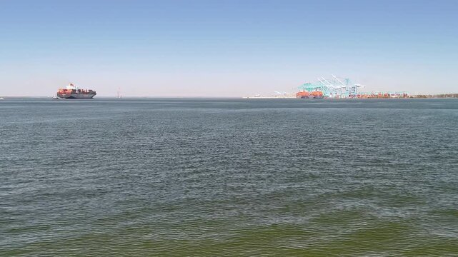 Aerial view of shipping containers and industrial port cranes on the Elizabeth River in Norfolk Virginia waterfront