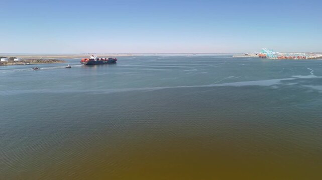 Aerial view of shipping containers and industrial port cranes on the Elizabeth River in Norfolk Virginia waterfront