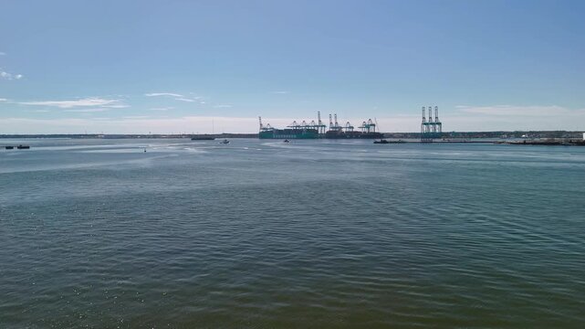 Aerial view of shipping containers and industrial port cranes on the Elizabeth River in Norfolk Virginia waterfront