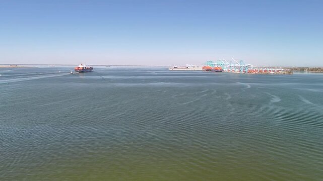 Aerial view of shipping containers and industrial port cranes on the Elizabeth River in Norfolk Virginia waterfront