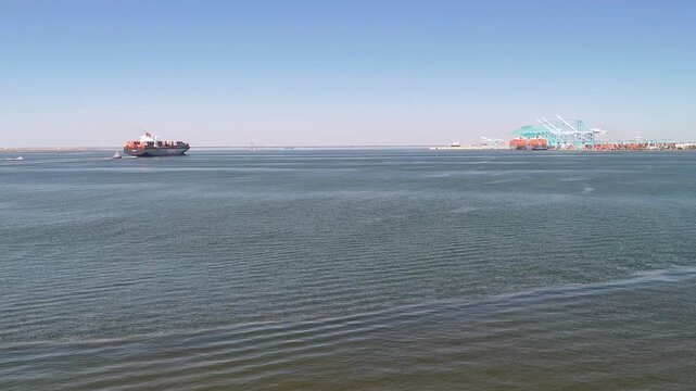 Aerial view of shipping containers and industrial port cranes on the Elizabeth River in Norfolk Virginia waterfront