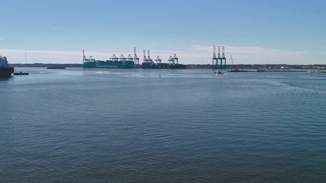 Aerial view of shipping containers and industrial port cranes on the Elizabeth River in Norfolk Virginia waterfront