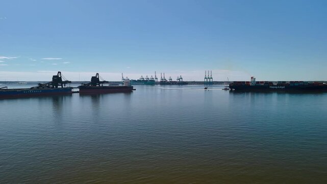 Aerial view of shipping containers and industrial port cranes on the Elizabeth River in Norfolk Virginia waterfront