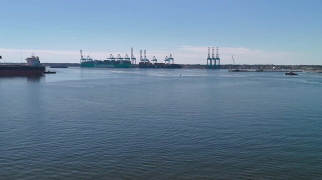 Aerial view of shipping containers and industrial port cranes on the Elizabeth River in Norfolk Virginia waterfront