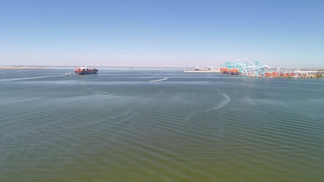 Aerial view of shipping containers and industrial port cranes on the Elizabeth River in Norfolk Virginia waterfront