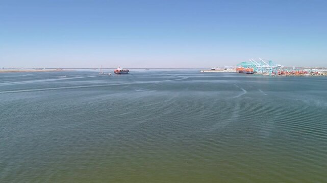 Aerial view of shipping containers and industrial port cranes on the Elizabeth River in Norfolk Virginia waterfront