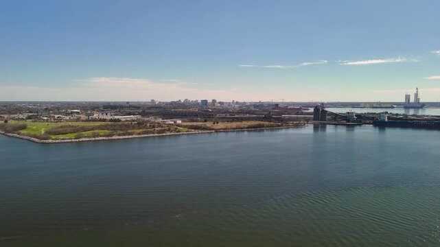 Aerial view of shipping containers and industrial port cranes on the Elizabeth River in Norfolk Virginia waterfront