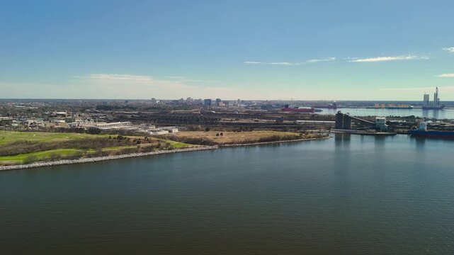 Aerial view of shipping containers and industrial port cranes on the Elizabeth River in Norfolk Virginia waterfront