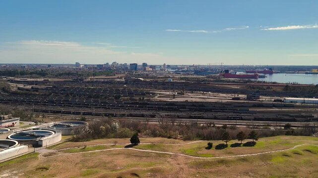 Aerial view of shipping containers and industrial port cranes on the Elizabeth River in Norfolk Virginia waterfront