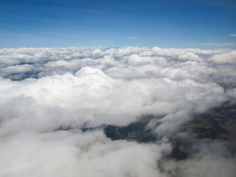 Aerial View of Vast White Clouds Under Clear Blue Sky