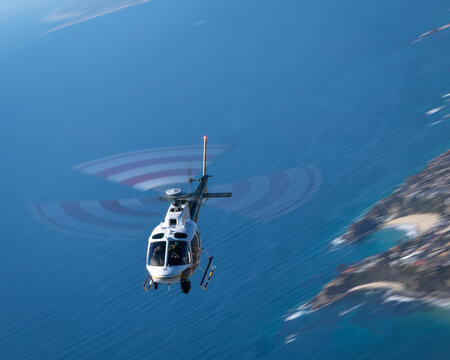 Helicopter (AS350)  over the California coast, at very low shutter speed