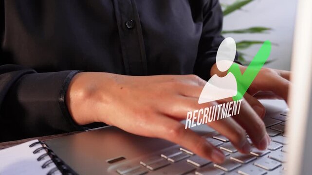 Close-up of a businesswoman working on her computer with an animated avatar icon, a checkmark, and the word "Recruitment." Finding the right staff.