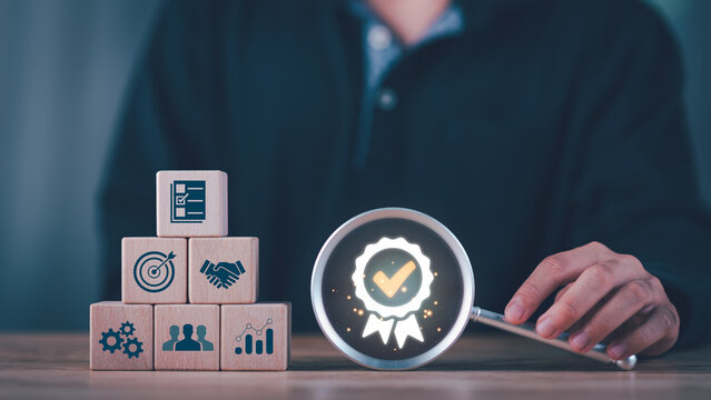 Quality assurance concept with wooden blocks , checklist validation, certified approval badge, highlighting performance measurement, organizational trust, process optimization, strategic evaluation.