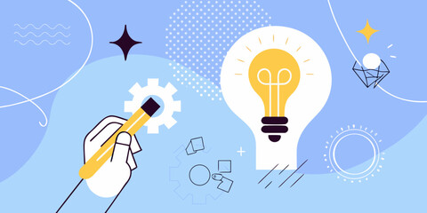 A hand drawing a bright lightbulb symbolizing creative thought © Babita