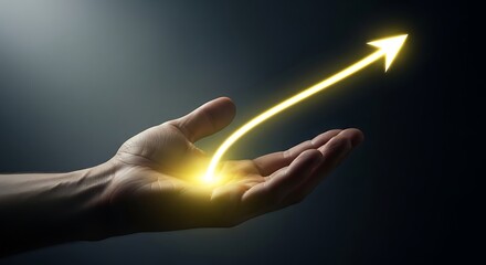 A hand holding a glowing yellow arrow pointing upwards in a dark background