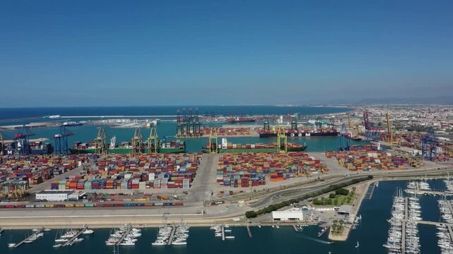 Breathtaking Panoramic aerial view of Port of Valencia container terminal and marina. Global demand for transportation of oil and other material across the world. 