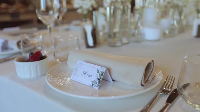 Elegant Wedding Table Setting with Place Card and Folded Napkin