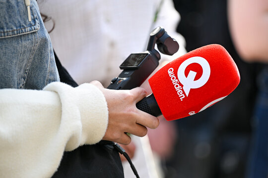 Illustration picture shows a microphone (mic, mike, micro) with the logo of the television show Quotidien on TMC in Paris, France on March, 8, 2026
