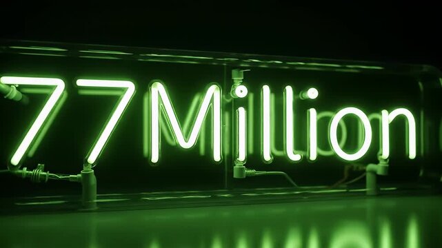 A neon sign reading 77 Million in a dark environment with green lighting